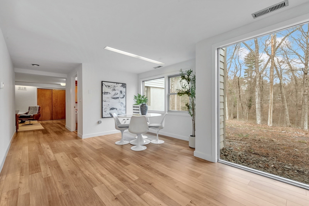 85 The Valley Road Concord, MA 01742 - Photo 32 of 38 a view of a big room with wooden floor swimming pool and windows