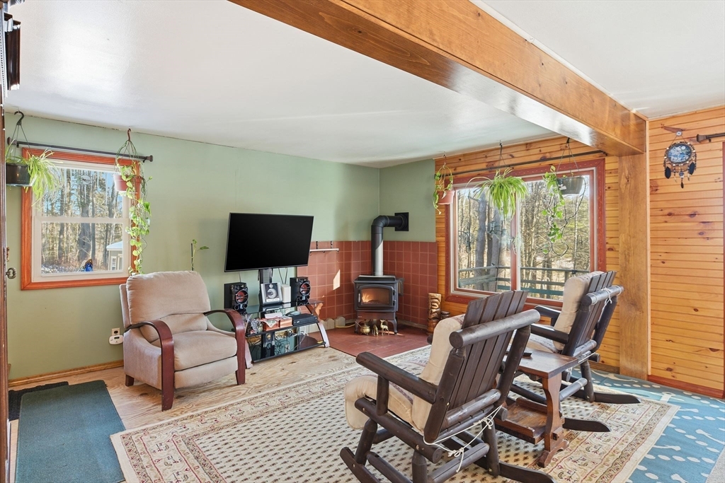 200 Fox Den Road Tolland, MA 01034 - Photo 8 of 37 a living room with furniture and a flat screen tv
