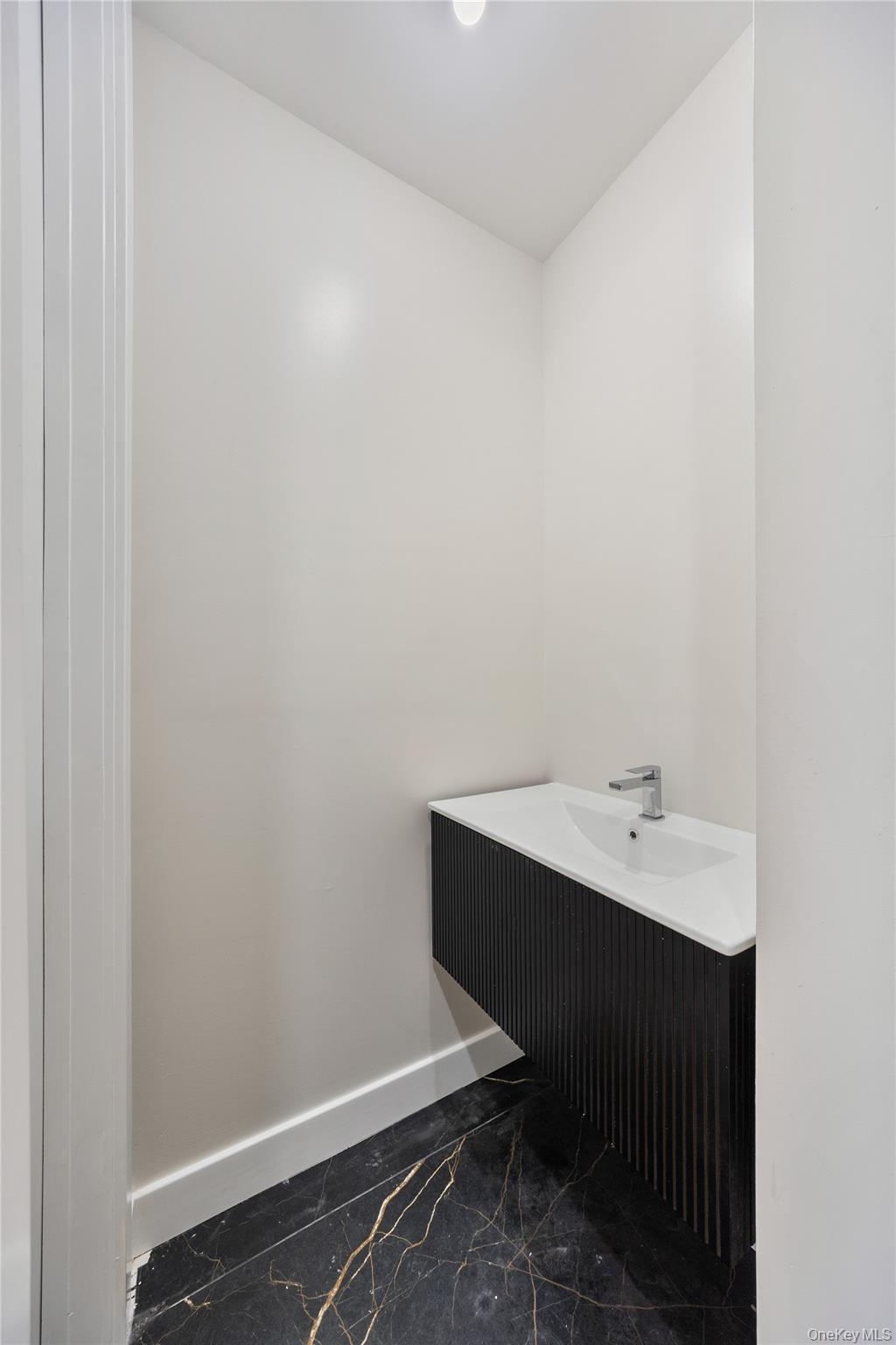 17 Lazer Court, Unit 103 Spring Valley, NY 10977 - Photo 21 of 36 a bathroom with a sink vanity and tub