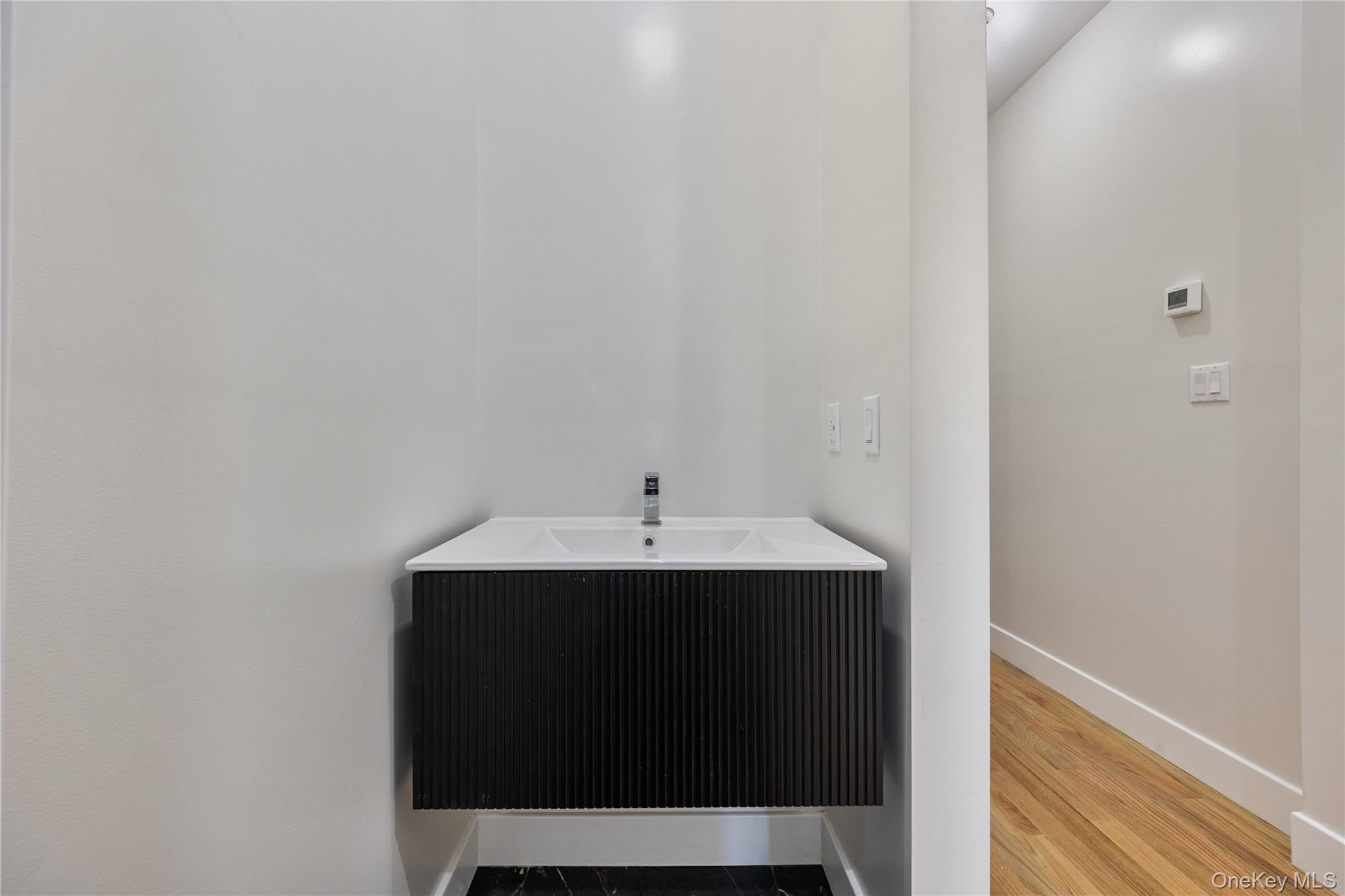17 Lazer Court, Unit 103 Spring Valley, NY 10977 - Photo 23 of 36 a utility room with a sink and a mirror