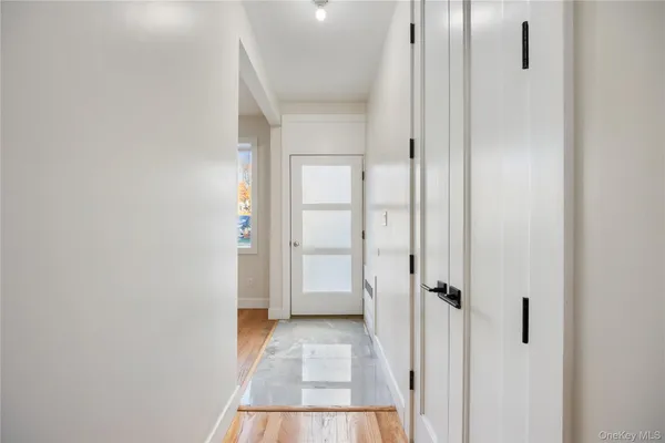a view of a bathroom from a hallway