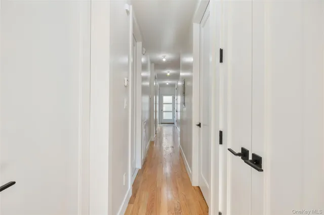 a view of a bathroom from a hallway