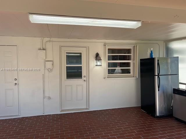 2820 Southwest 65th Avenue Miramar, FL 33023 - Photo 18 of 24 a view of an empty room with wooden floor and a cabinet