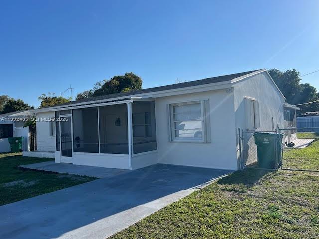 2820 Southwest 65th Avenue Miramar, FL 33023 - Photo 2 of 24 a front view of house with a garden