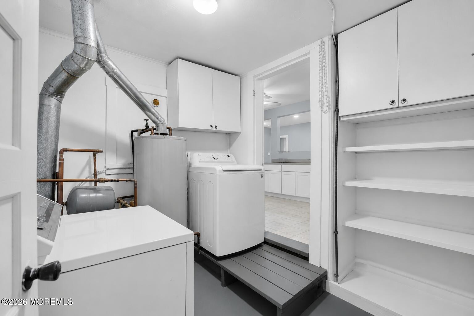 269 Alexander Avenue Howell, NJ 07731 - Photo 26 of 43 a view of storage and utility room with washer and dryer