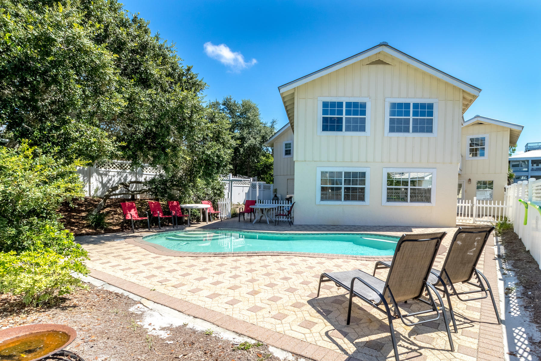 522 Defuniak Street, Unit 30A Santa Rosa Beach, FL 32459 - Photo 20 of 46 a front view of a house with garden