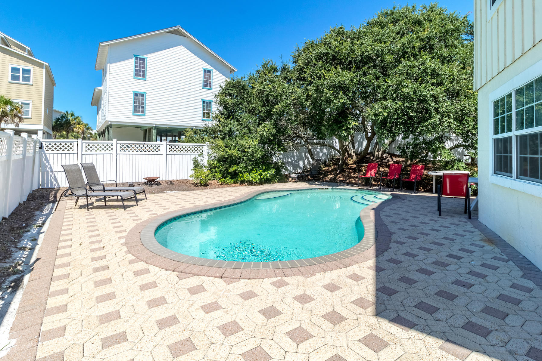 522 Defuniak Street, Unit 30A Santa Rosa Beach, FL 32459 - Photo 21 of 46 a swimming pool with outdoor seating and yard