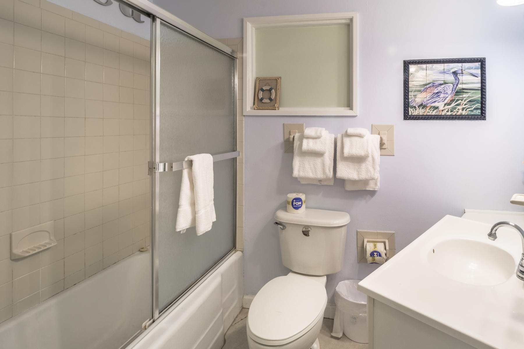 522 Defuniak Street, Unit 30A Santa Rosa Beach, FL 32459 - Photo 24 of 46 a white toilet sitting next to a bath tub shower