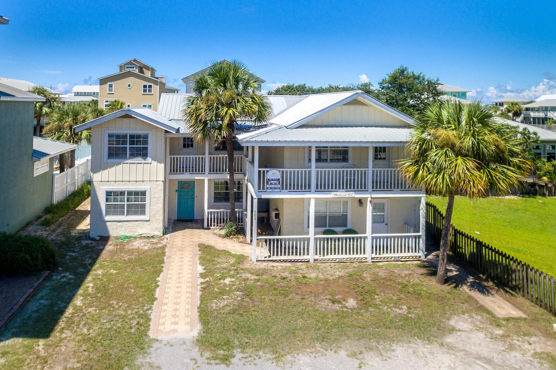 522 Defuniak Street, Unit 30A Santa Rosa Beach, FL 32459 - Photo 3 of 46 a front view of a house with a garden