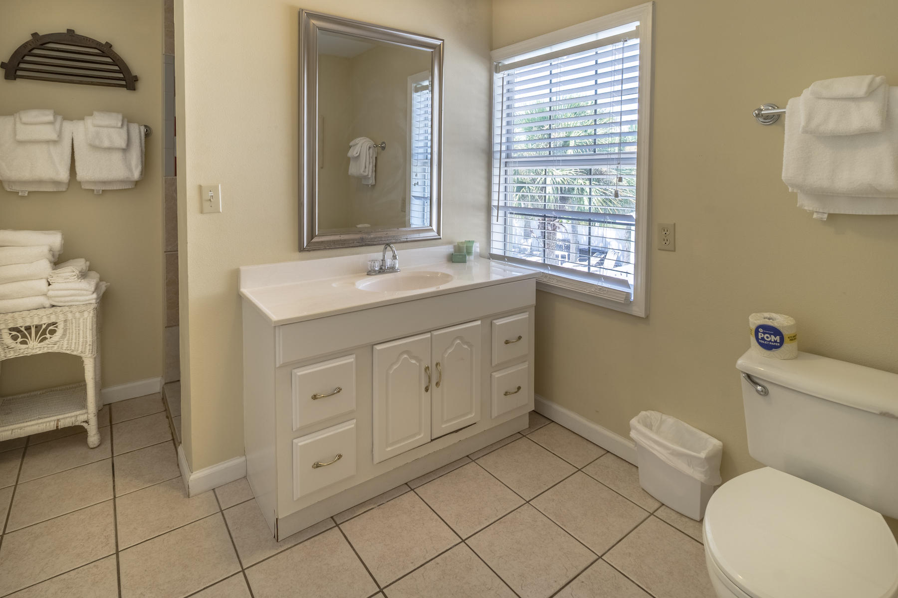 522 Defuniak Street, Unit 30A Santa Rosa Beach, FL 32459 - Photo 36 of 46 a spacious bathroom with a toilet sink and mirror