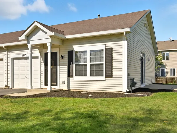 a view of a house with backyard