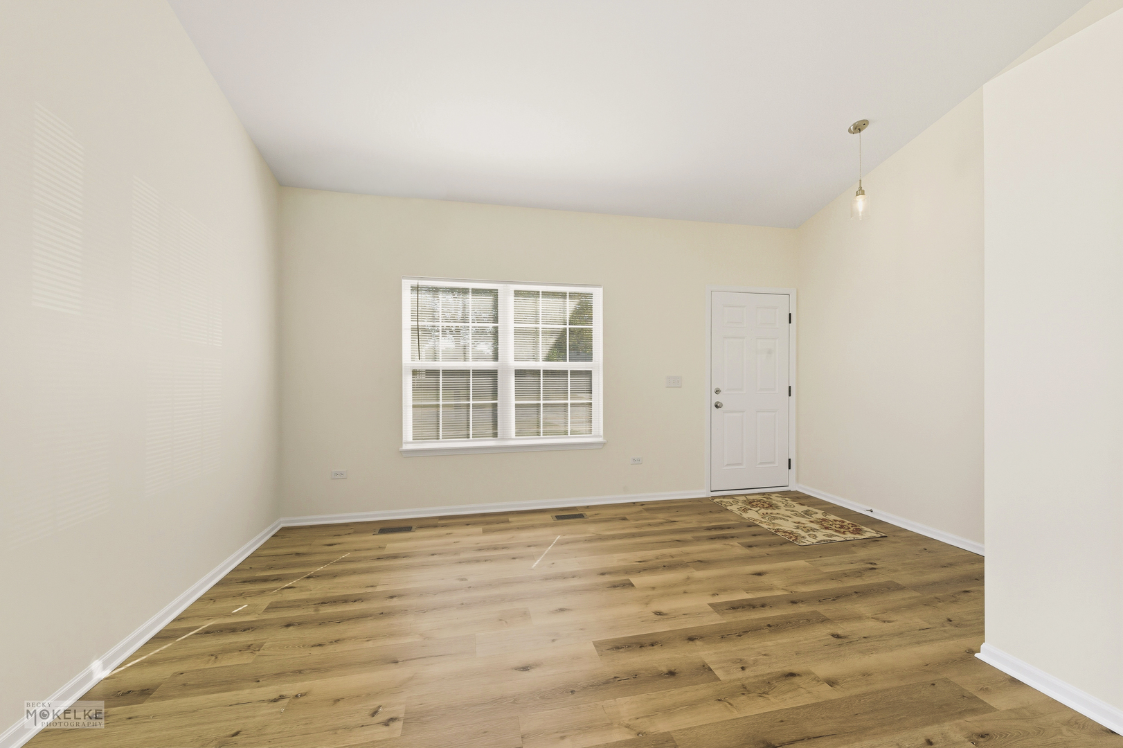 2813 Hoffman Street Plano, IL 60545 - Photo 12 of 27 a view of empty room with wooden floor and fan