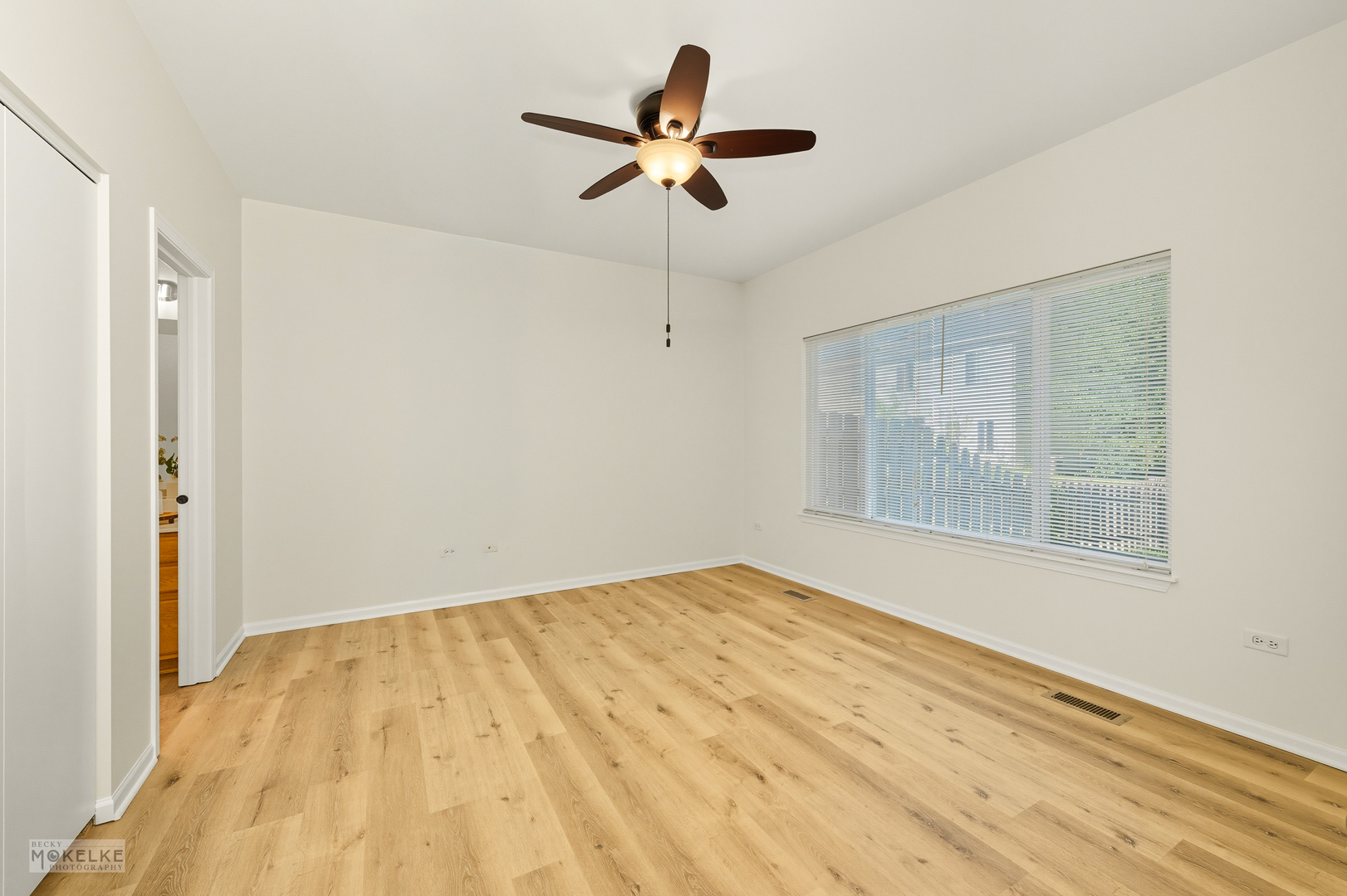 2813 Hoffman Street Plano, IL 60545 - Photo 17 of 27 a view of empty room with wooden floor and fan