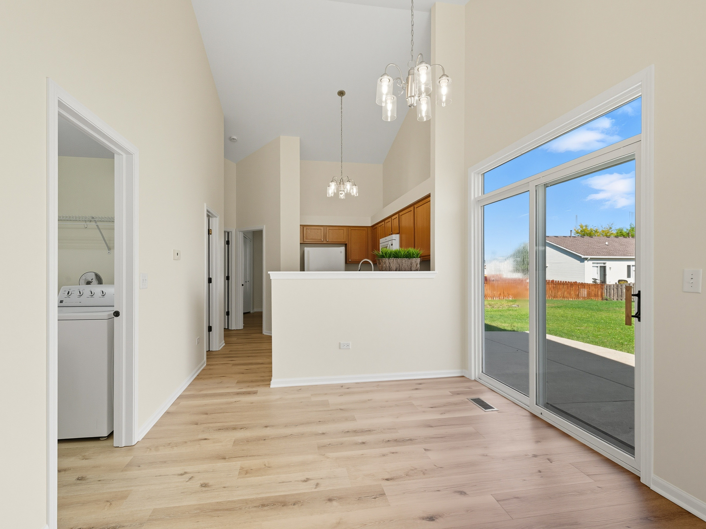 2813 Hoffman Street Plano, IL 60545 - Photo 8 of 27 a view of a big room with wooden floor and windows