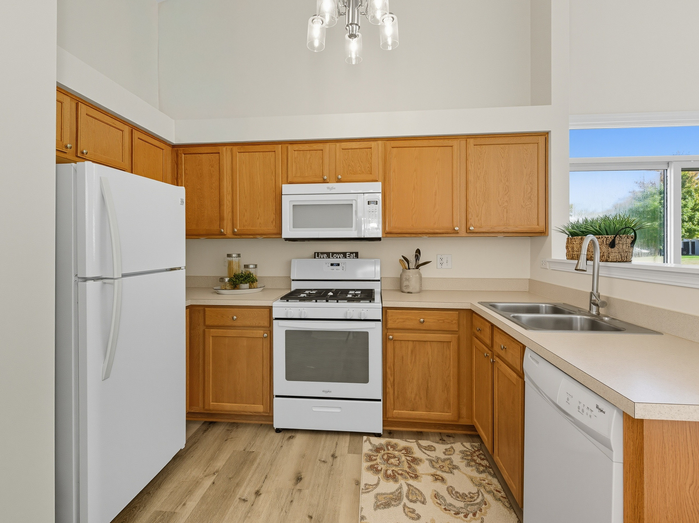 2813 Hoffman Street Plano, IL 60545 - Photo 9 of 27 a kitchen with a sink stove and refrigerator