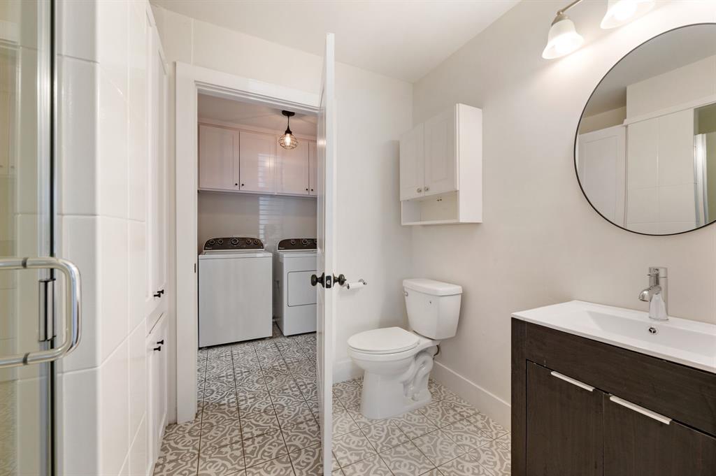 504 Main Street Roanoke, TX 76262 - Photo 21 of 40 a bathroom with a toilet sink and mirror
