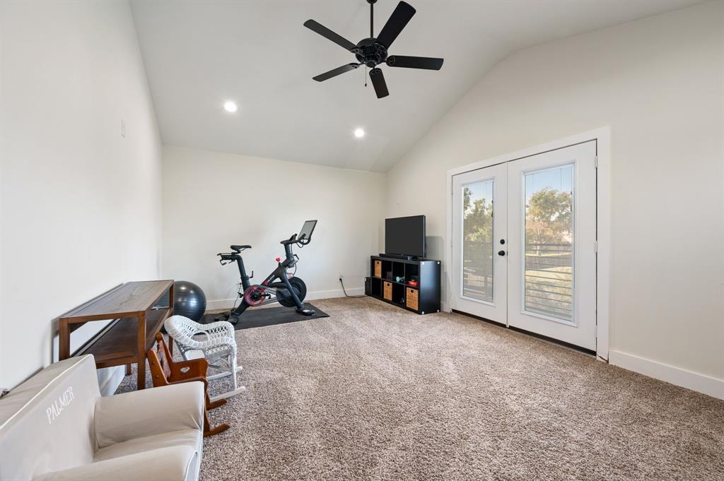 504 Main Street Roanoke, TX 76262 - Photo 24 of 40 a view of a livingroom with furniture and a ceiling fan