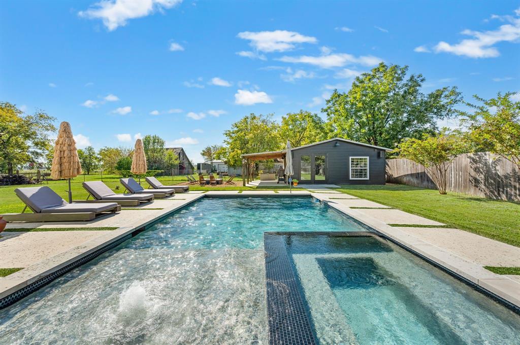 504 Main Street Roanoke, TX 76262 - Photo 31 of 40 a view of swimming pool with outdoor seating and a pathway