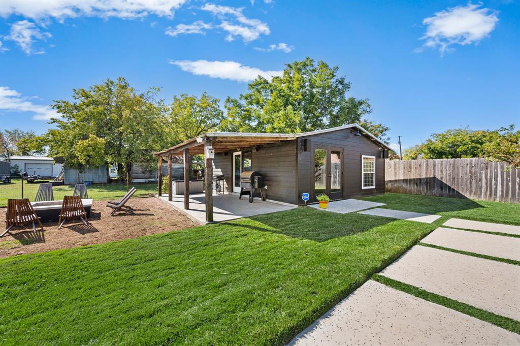 504 Main Street Roanoke, TX 76262 - Photo 32 of 40 a view of a house with backyard and sitting area