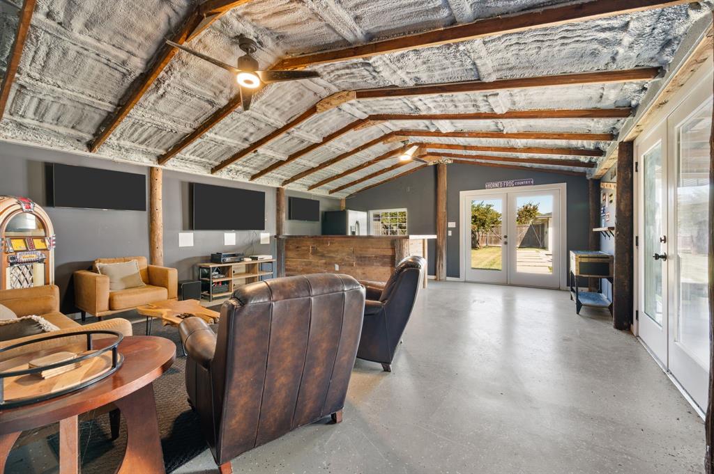 504 Main Street Roanoke, TX 76262 - Photo 34 of 40 a living room with furniture and a flat screen tv