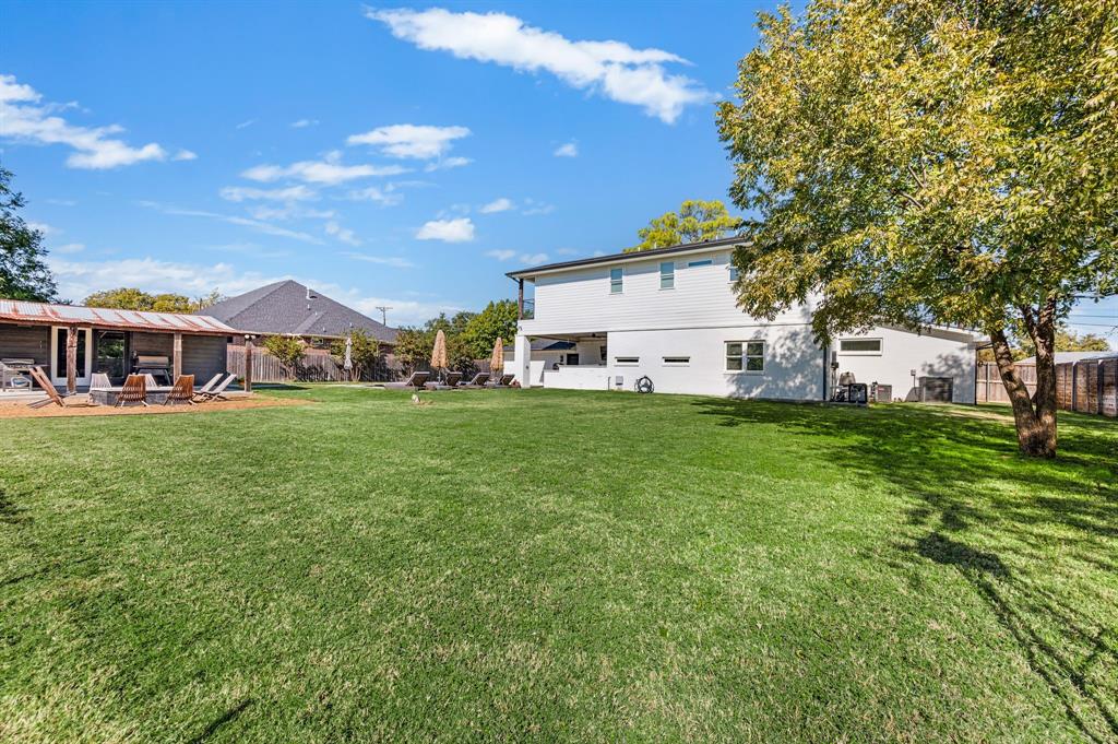 504 Main Street Roanoke, TX 76262 - Photo 36 of 40 a view of a house with a big yard and large trees