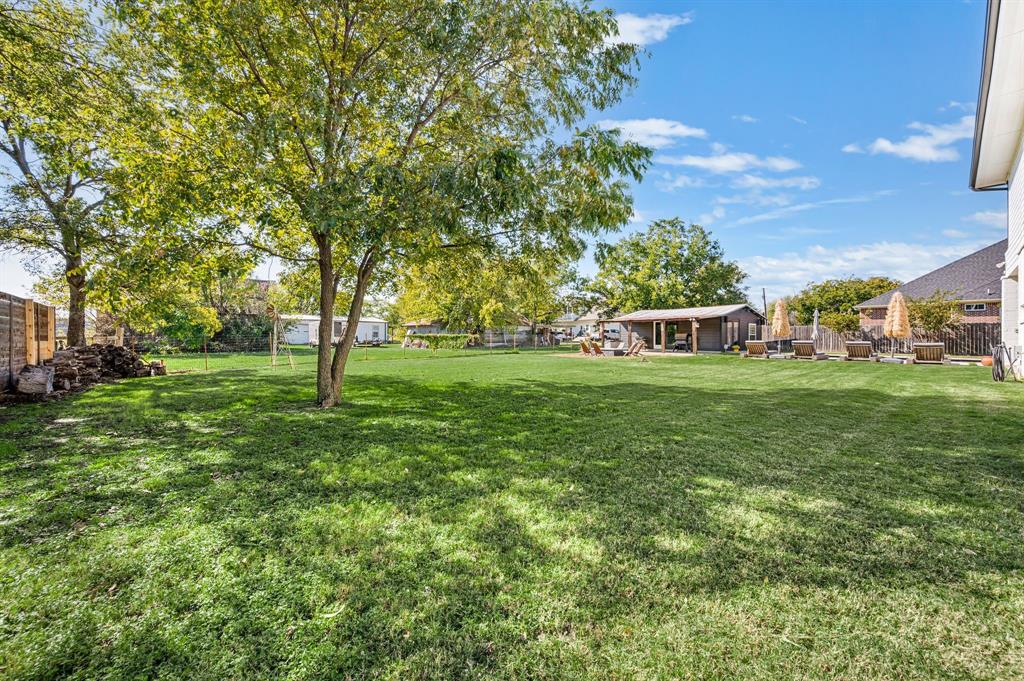 504 Main Street Roanoke, TX 76262 - Photo 37 of 40 a view of a tree in front of a house