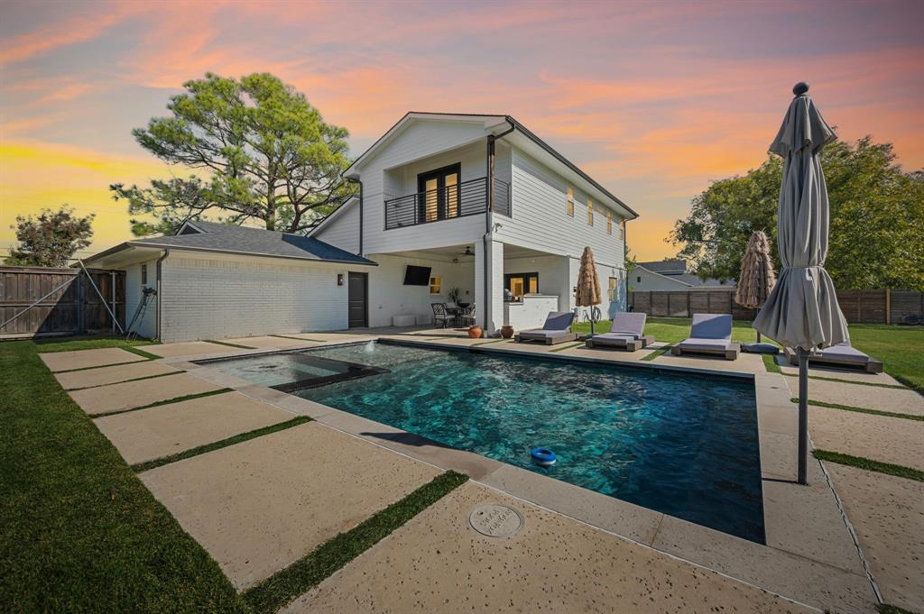 504 Main Street Roanoke, TX 76262 - Photo 40 of 40 a view of a white house with a yard and sitting area