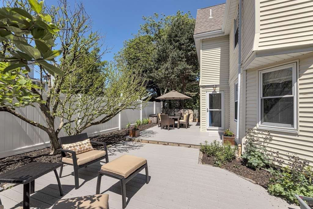 112 Perham Street Boston, MA 02132 - Photo 28 of 36 a view of pool with lawn chairs under an umbrella