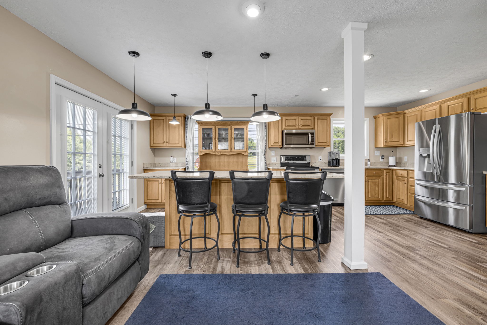 670 Still Pond Road Columbia, TN 38401 - Photo 13 of 43 a living room with stainless steel appliances kitchen island granite countertop a dining table chairs refrigerator and kitchen view