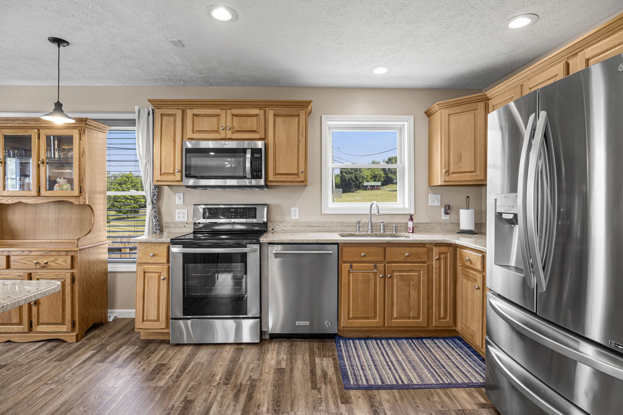 670 Still Pond Road Columbia, TN 38401 - Photo 16 of 43 a kitchen with stainless steel appliances a stove a sink and a refrigerator
