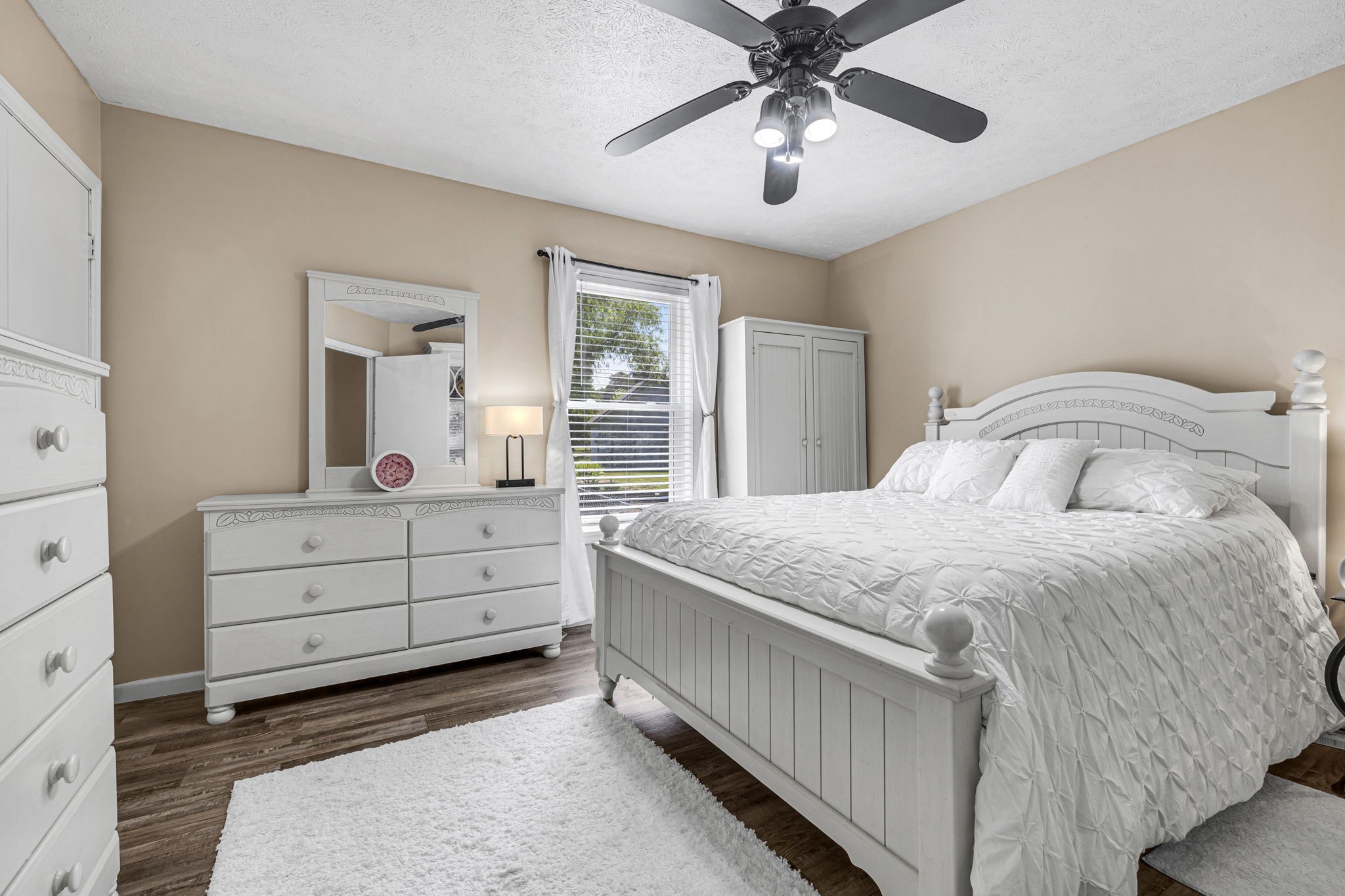 670 Still Pond Road Columbia, TN 38401 - Photo 20 of 43 a bedroom with a bed and a chandelier