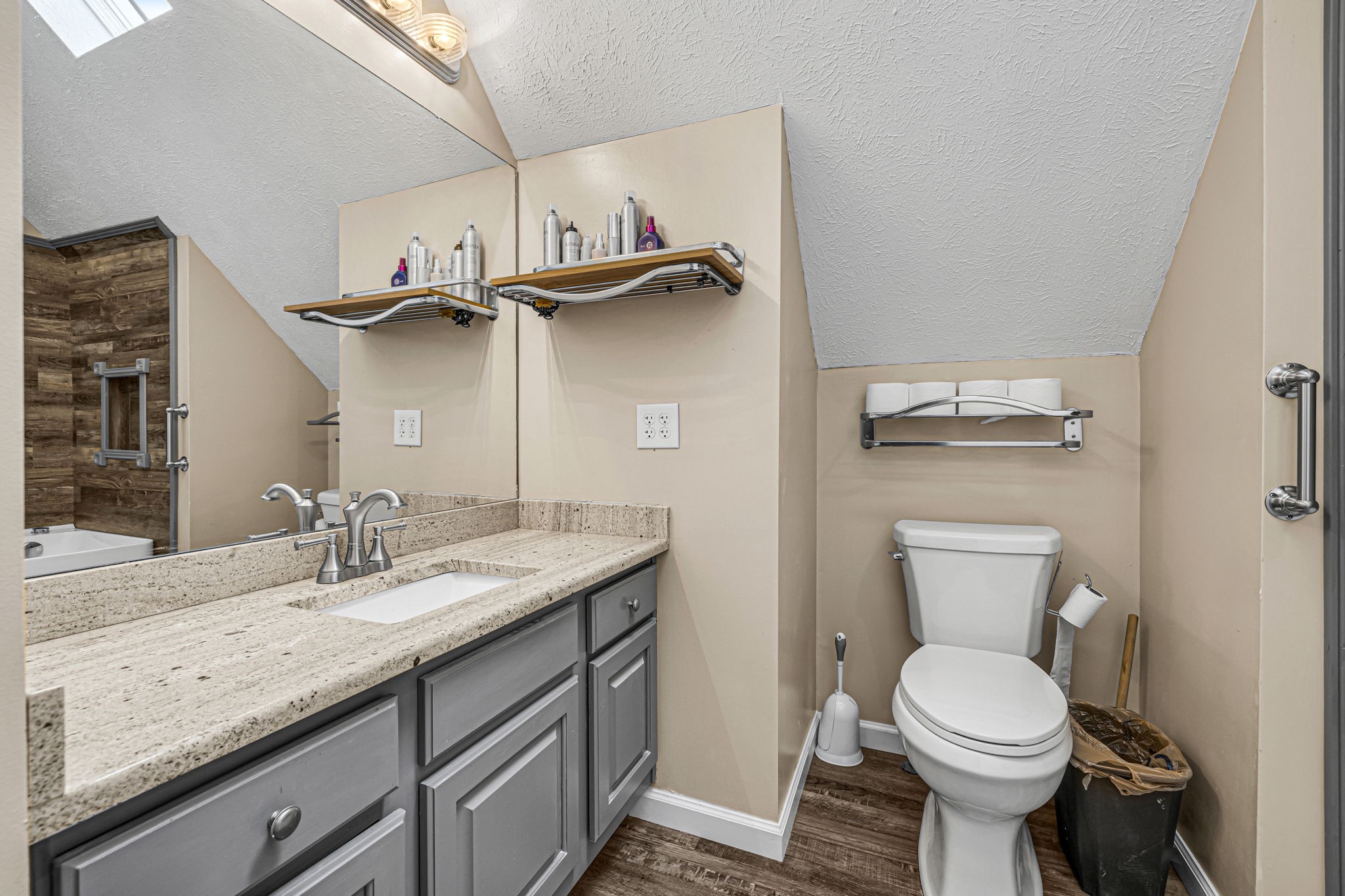 670 Still Pond Road Columbia, TN 38401 - Photo 27 of 43 a bathroom with a granite countertop toilet sink and mirror