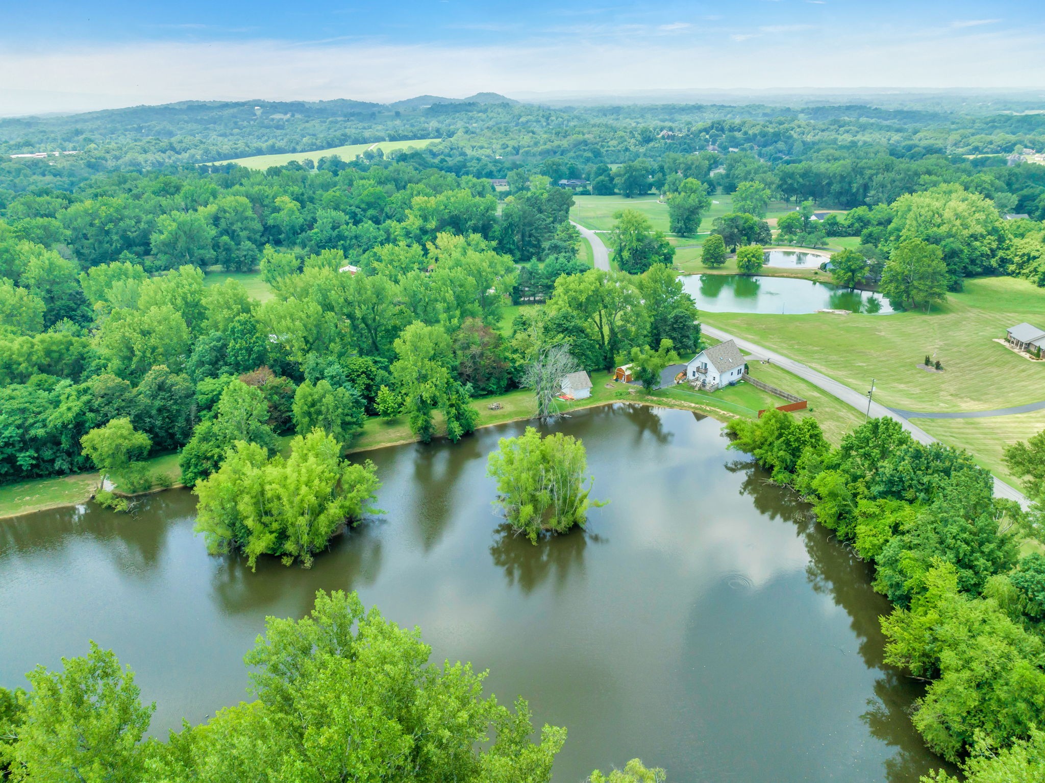 670 Still Pond Road Columbia, TN 38401 - Photo 39 of 43 a view of a lake with a city