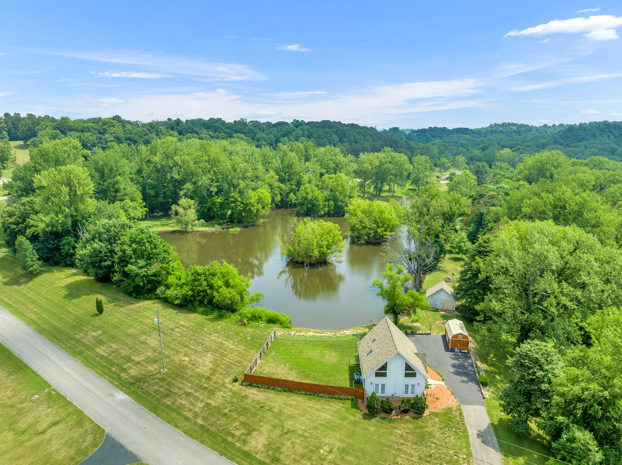 670 Still Pond Road Columbia, TN 38401 - Photo 41 of 43 a view of a lake with a garden