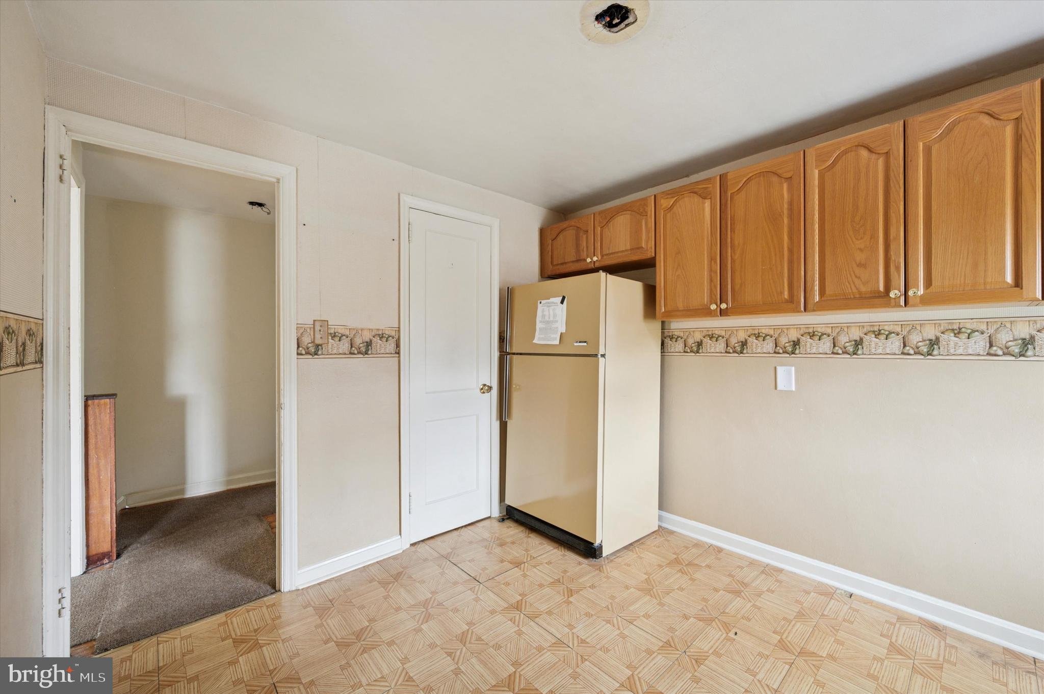 363 Holmes Road Holmes, PA 19043 - Photo 18 of 25 a view of cabinets with refrigerator in kitchen
