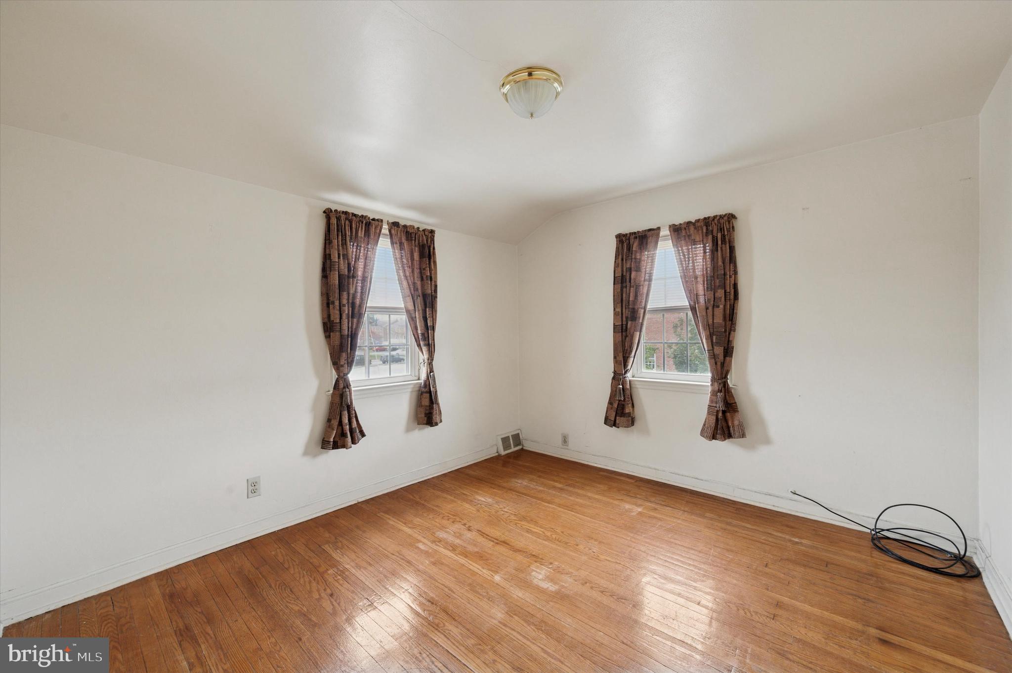 363 Holmes Road Holmes, PA 19043 - Photo 21 of 25 an empty room with windows and closet