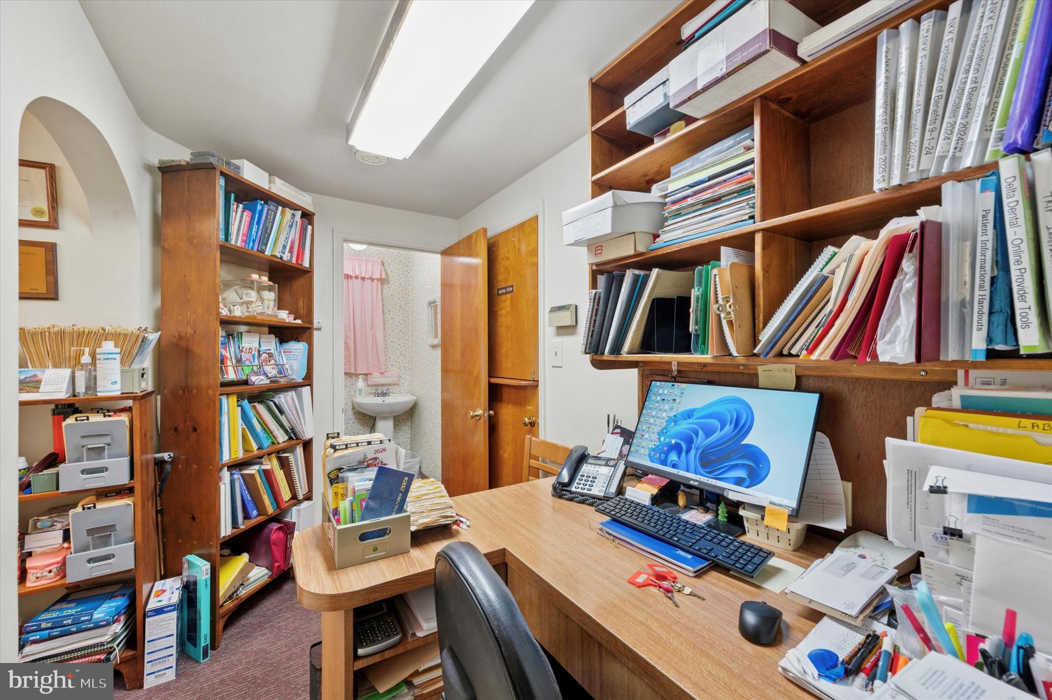 363 Holmes Road Holmes, PA 19043 - Photo 7 of 25 a room with furniture and a book shelf