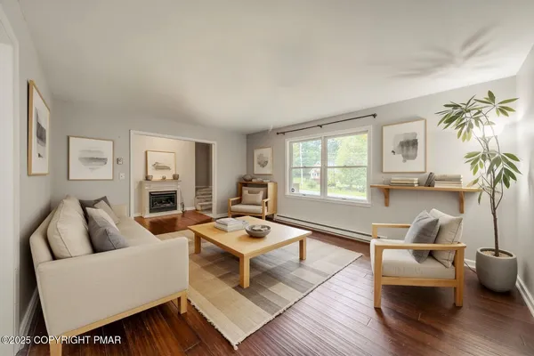 a living room with furniture and a window