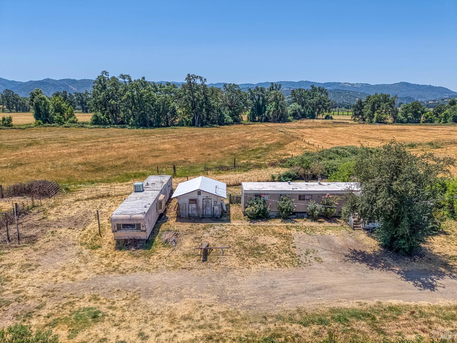 9705 East Potter Valley Road Potter Valley, CA 95469 - Photo 2 of 16 a view of a lake with an outdoor space