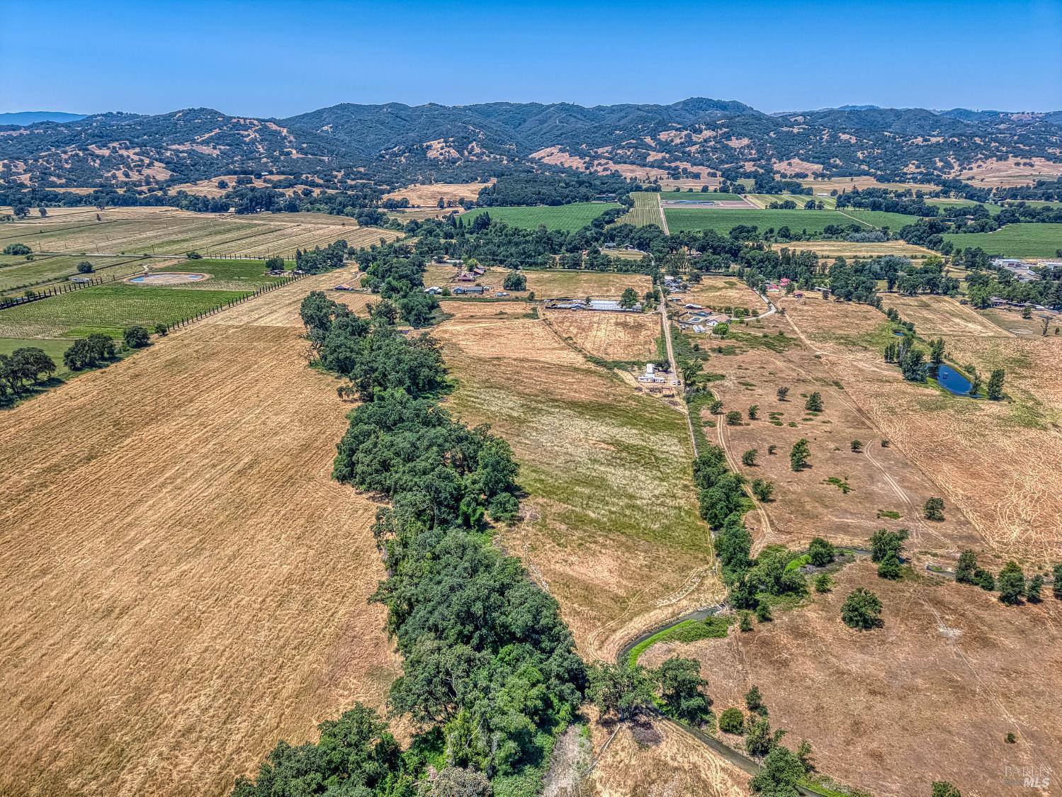 9705 East Potter Valley Road Potter Valley, CA 95469 - Photo 6 of 16 an aerial view of lake residential house with swimming pool and mountains
