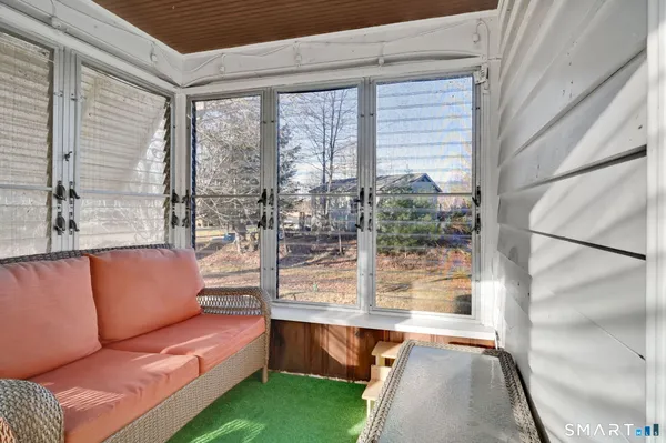 a bedroom with a bed and a television