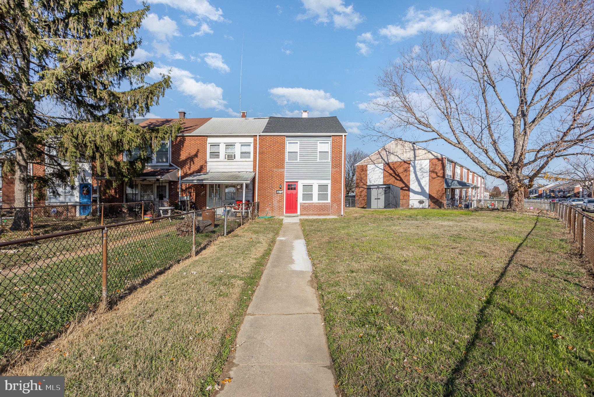 2070 Larkhall Road Dundalk, MD 21222 - Photo 2 of 26 a view of a brick building next to a yard