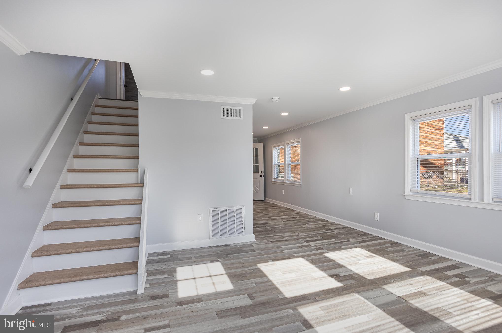2070 Larkhall Road Dundalk, MD 21222 - Photo 24 of 26 a view of an entryway with wooden floor and windows