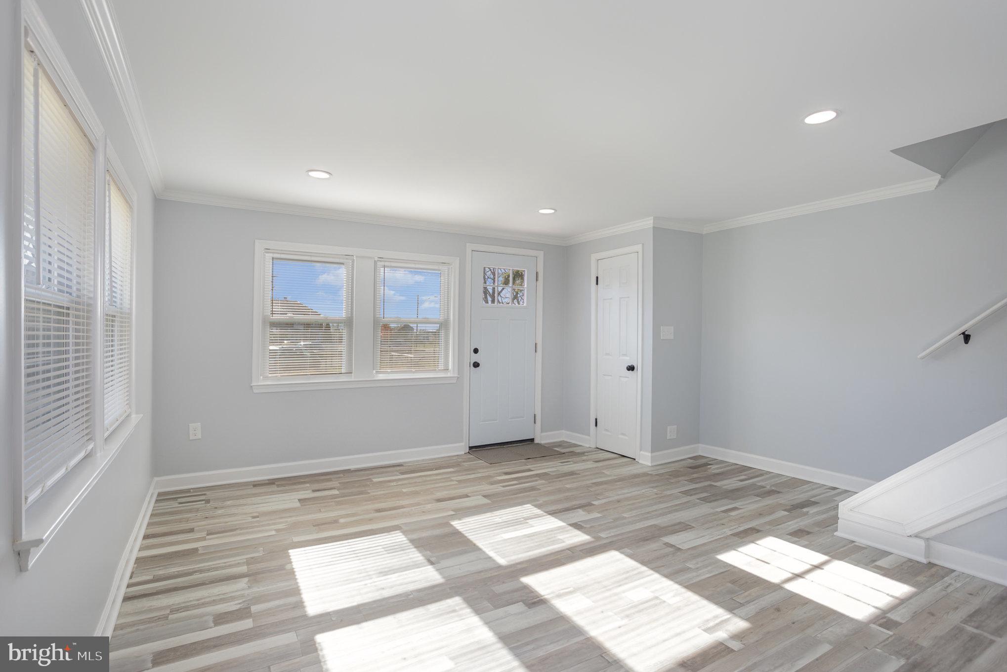 2070 Larkhall Road Dundalk, MD 21222 - Photo 4 of 26 a view of an empty room with a window
