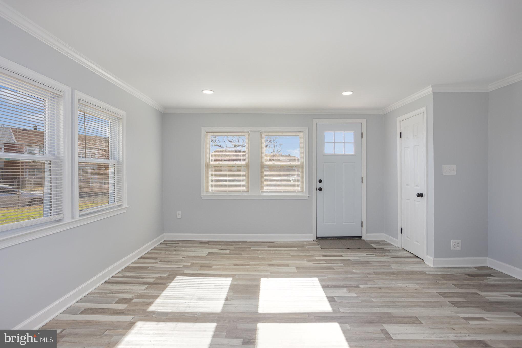 2070 Larkhall Road Dundalk, MD 21222 - Photo 5 of 26 a view of an empty room with a window