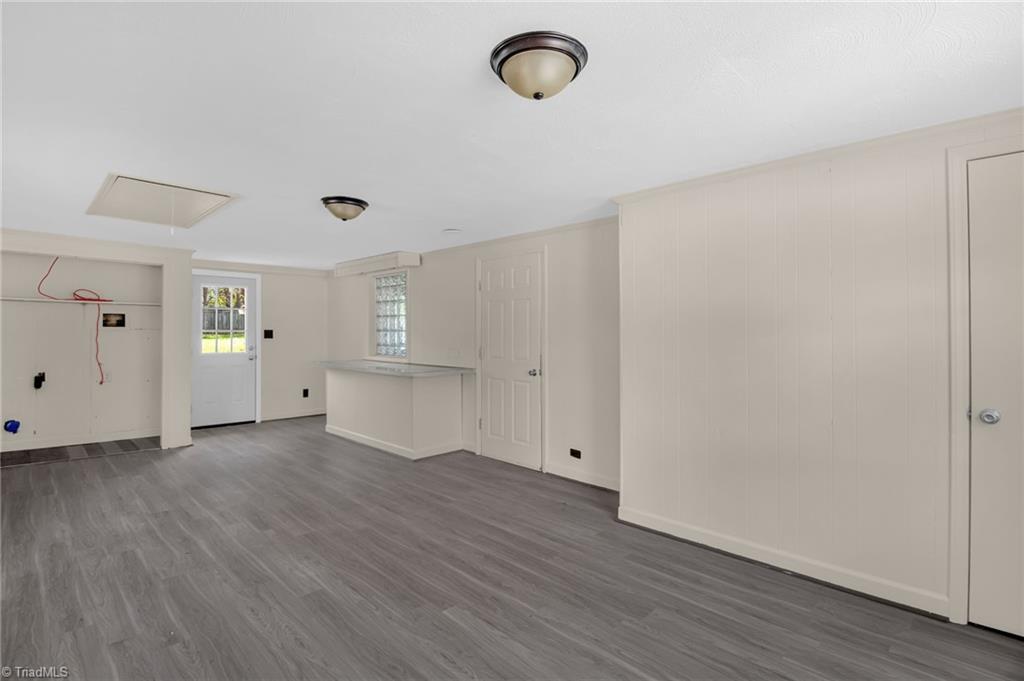 8225 Easley Road Walnut Cove, NC 27052 - Photo 15 of 33 Laundry room area, den space or dining space with bar. Door leads to the backyard.