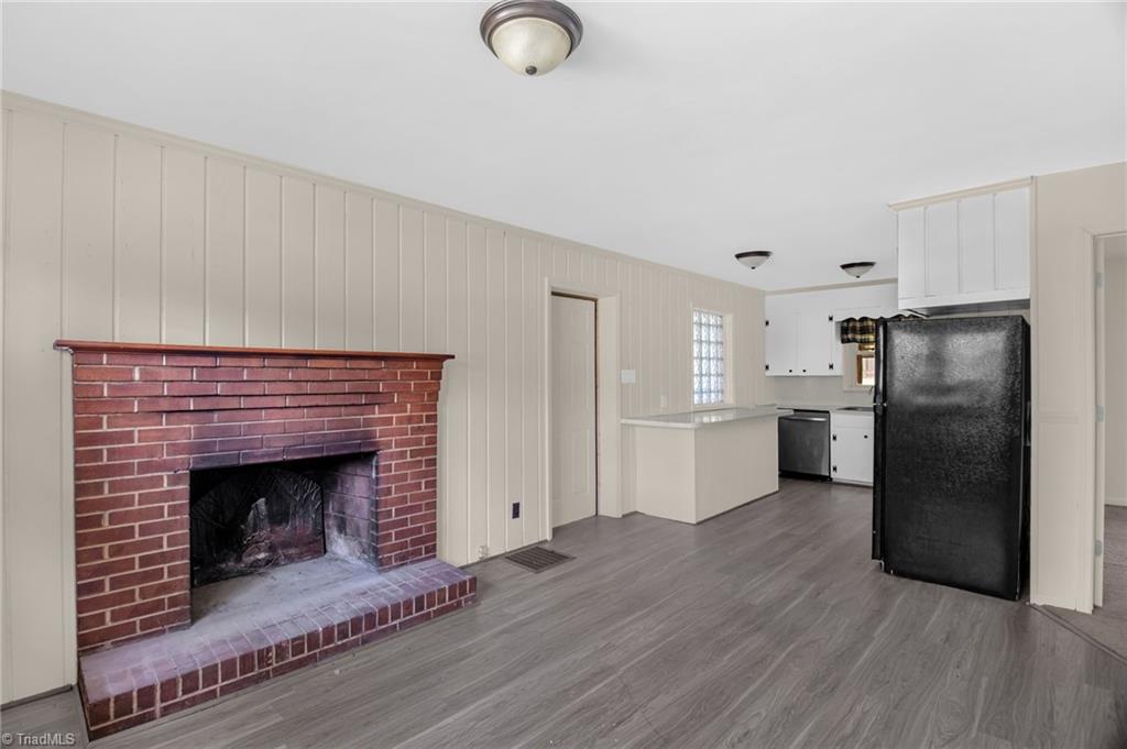 8225 Easley Road Walnut Cove, NC 27052 - Photo 9 of 33 Dining area or den with fireplace looking into kitchen