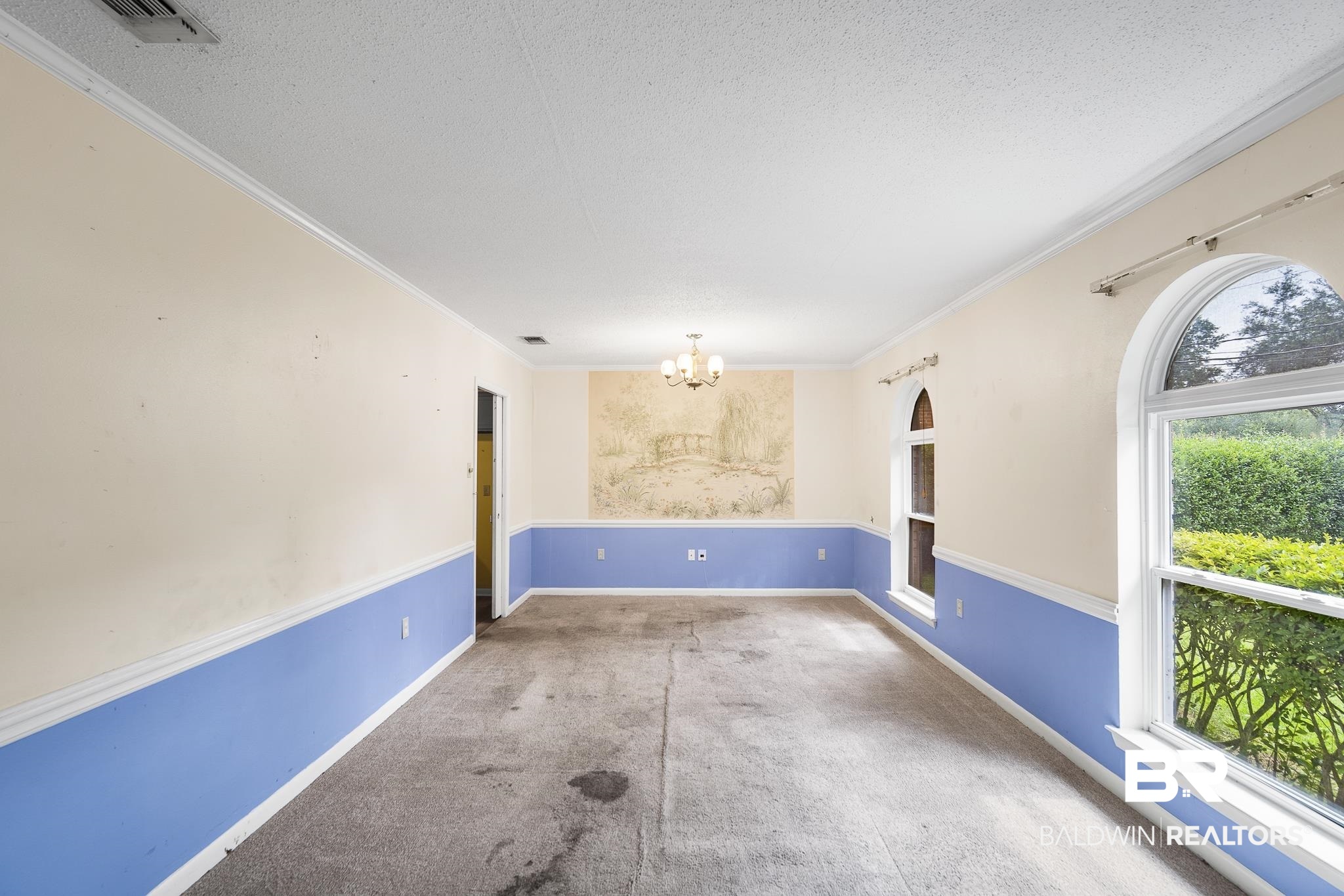 2710 Longleaf Drive Mobile, AL 36693 - Photo 6 of 27 Spare room with a notable chandelier and a textured ceiling