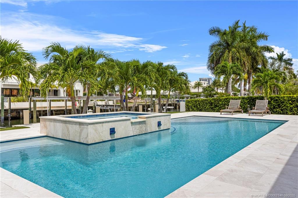 1110 Fairview Lane Riviera Beach, FL 33404 - Photo 55 of 76 Heated pool and hot tub, with auto water-leveling system