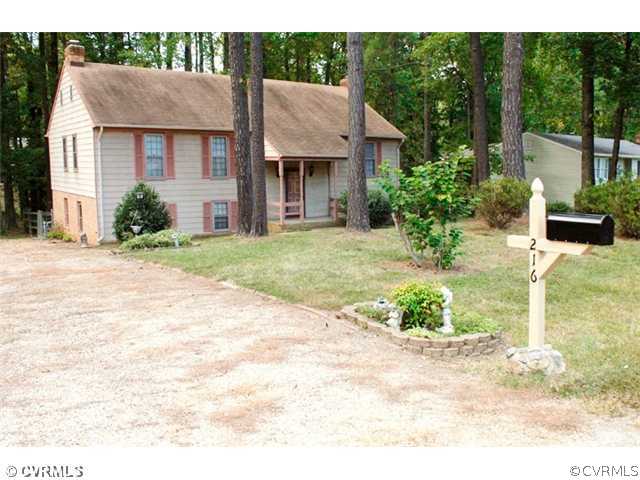 216 Chasnell Road Chesterfield, VA 23236 - Photo 2 of 23 a front view of a house with a yard and potted plants